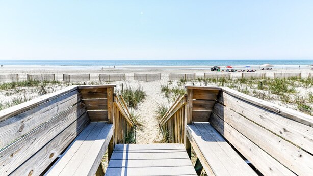 A wooden boardwalk leading to a beach with a clear view of the ocean. - Oceanfront 2 BR Condo with Shared Pool! Sea Shadow 406  (Surfside Beach)