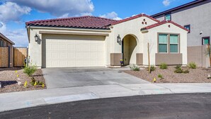 A single-story house with a garage, a red-tiled roof, and a small front yard with landscaping. - 5 Mi to Westgate! Newly Built Family Retreat (Glendale)