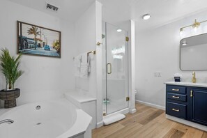 Shower, hair dryer, towels, shampoo