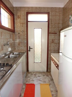 Fridge, stovetop, cookware/dishes/utensils