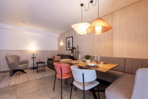Apartment | Living area | 48-inch flat-screen TV with cable channels, heated floors - wohngenuss apprtements (Schladming)