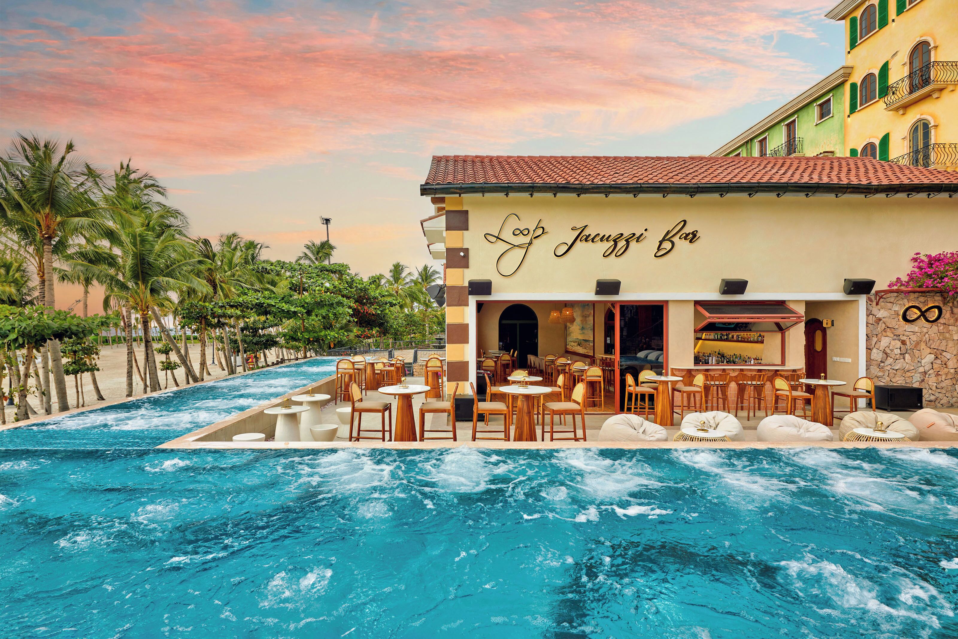 A poolside bar with outdoor seating and a view of the pool.