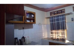 Private kitchen - Tranquil Luxury Retreat: 2-Bedroom Haven (Kampala)