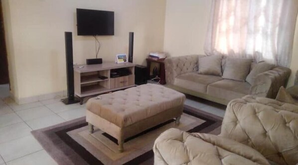 Living area - Tranquil Luxury Retreat: 2-Bedroom Haven (Kampala)