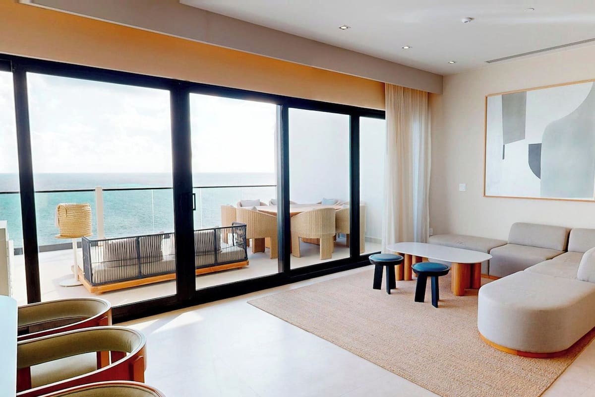 Suite, 2 Bedrooms (Penthouse) | Living area | 65-inch LED TV with cable channels, tablet, pay movies