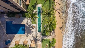 An aerial view of a resort with a swimming pool, beach, and palm trees. - ❤️Best Views on Maui! Perfect for Honeymooners!!❤️ (Lahaina)