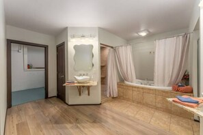 Jetted bath, hair dryer, towels, soap