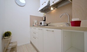 Fridge, microwave, stovetop, cookware/dishes/utensils