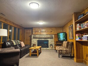 Smart TV, fireplace, DVD player, books
