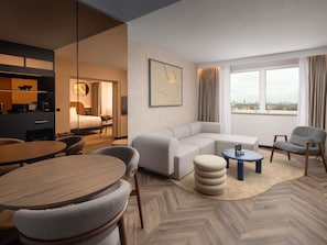 Jr Suite King Bed, Bath and Rainfall Shower. Living area with Sofa, High Floor with City View