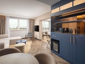 Jr Suite King Bed, Bath and Rainfall Shower. Living area with Sofa, High Floor with City View