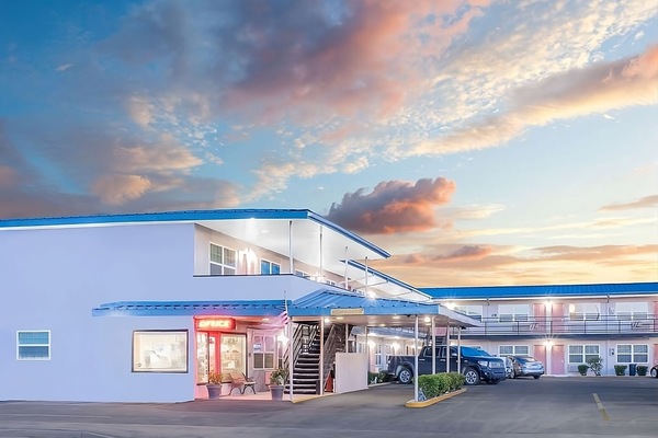 Arrive at dusk to a welcoming, well-lit entrance.