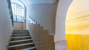 A staircase with marble steps leading up to a landing. - Napoli Street Art Rooms - Wall by Wonderful Italy (Naples)