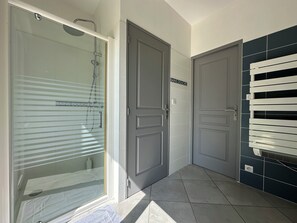 Shower, hair dryer, towels, soap