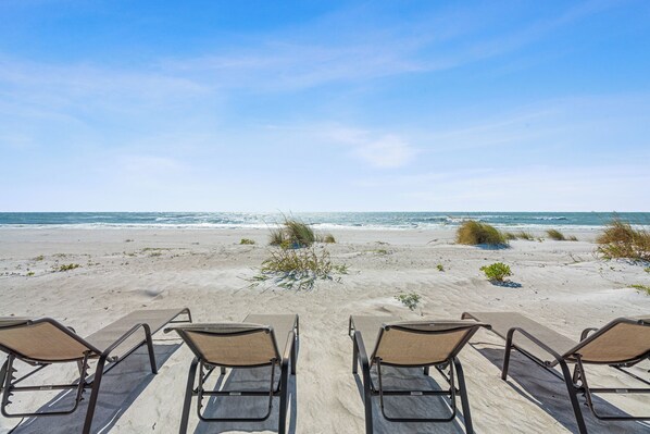 On the beach, sun-loungers
