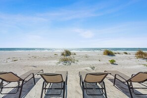 On the beach, sun-loungers
