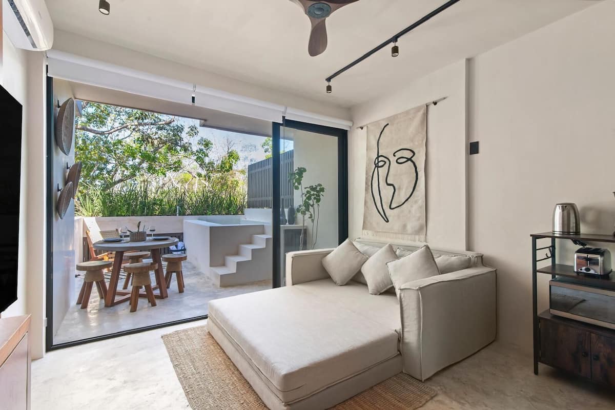 Junior Apartment | Living room | 60-inch flat-screen TV with digital channels