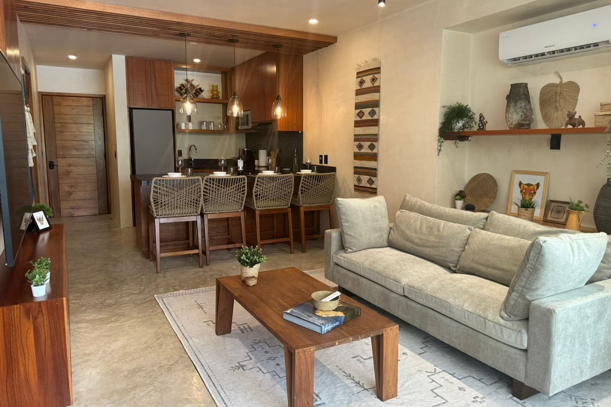 Elite Apartment | Living area | 60-inch flat-screen TV with digital channels