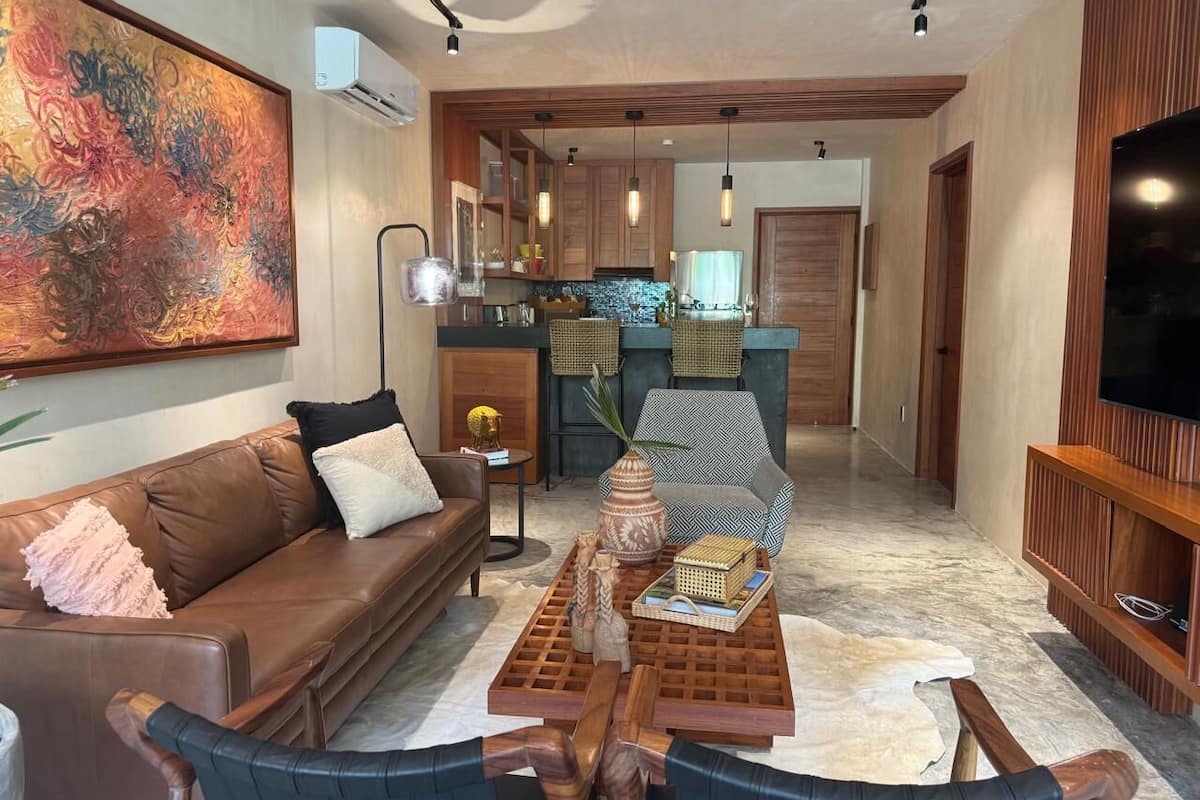 Comfort Apartment | Living area | 60-inch flat-screen TV with digital channels