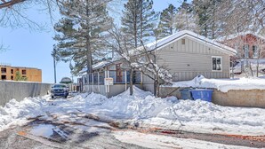 A residential area with a house covered in snow, a parked truck, and a clear sky. - Flagstaff Home w/ Grill: 3 Mi to Historic Downtown (Flagstaff)
