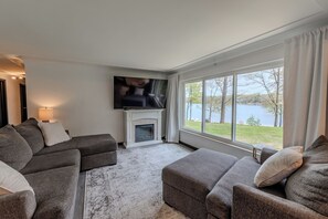 Smart TV, fireplace, books, computer monitors