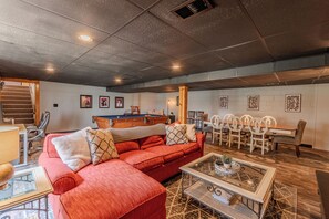 Smart TV, fireplace, books, computer monitors