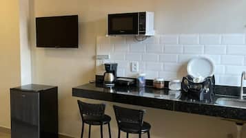 Fridge, microwave, cookware/dishes/utensils