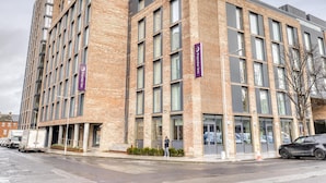 A multi-story hotel with a brick facade, large windows, and a prominent Premier Inn sign. - Premier Inn Dublin Cc The Liberties (Dublin)