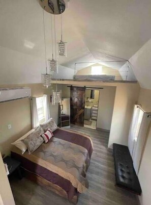 A compact room with a bunk bed, a small desk, and a bench. - Vibes Cowboy: Rhinestone Cowboy (Marfa)