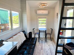 Interior - Belford is a 1-4 person Tiny Home with bathroom, fridge, induction cooktop, microwave, AC/heat, and beautiful mountain views! (Buena Vista)