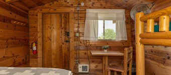 1 Room Dry Camping Cabin. Sleeps up to 4 in one queen bed and a set of twin bunks.