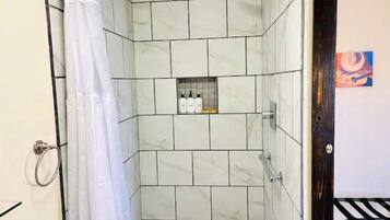 Shower, hair dryer, towels, soap