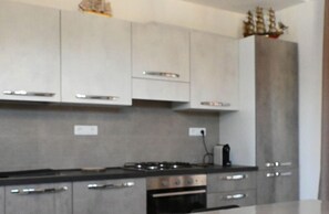 Fridge, oven, dishwasher, dining tables