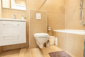 Shower, hair dryer, towels, shampoo