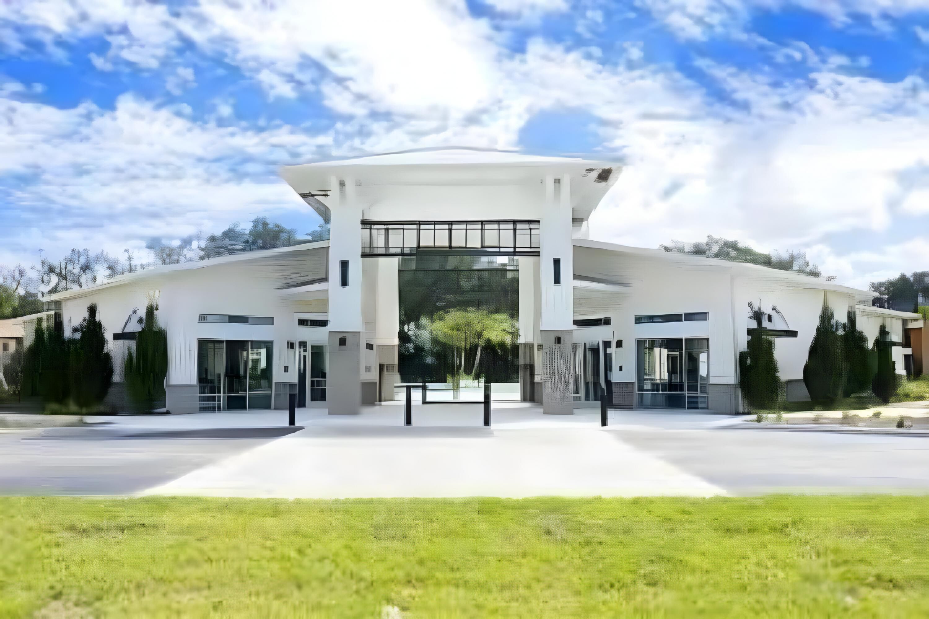 A modern building with a curved roof and large glass windows.
