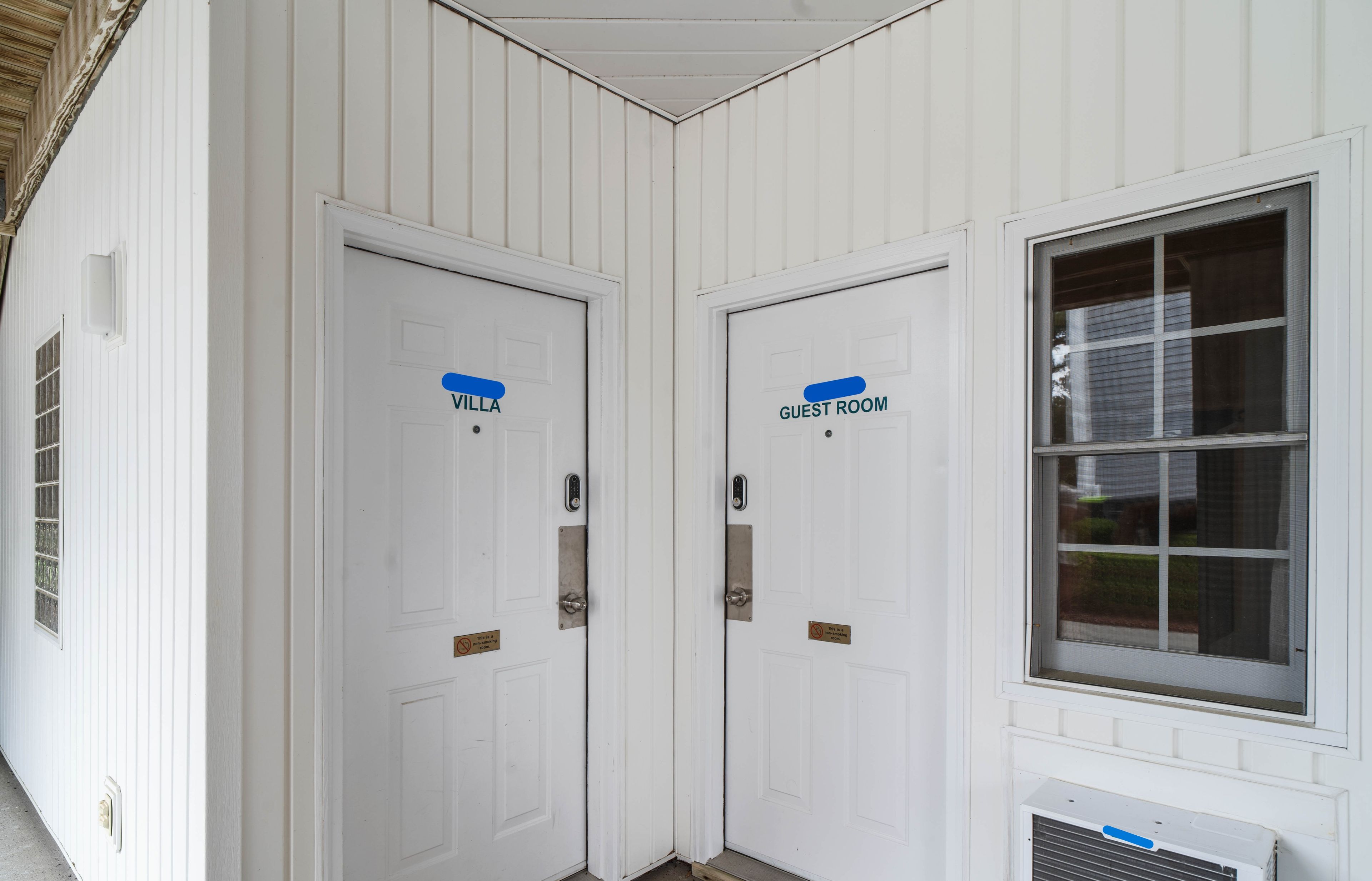 Two white doors with labels 'Villa' and 'Guest Room' indicating separate accommodations.