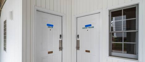 Two white doors with labels 'Villa' and 'Guest Room' indicating separate accommodations.