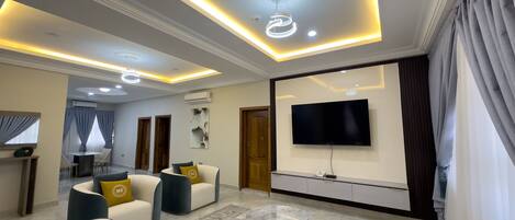 Luxury Apartment, 3 Bedrooms | Living area | 50-inch Smart TV with satellite channels
