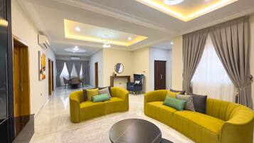 Luxury Apartment, 2 Bedrooms | Living area | 50-inch Smart TV with satellite channels