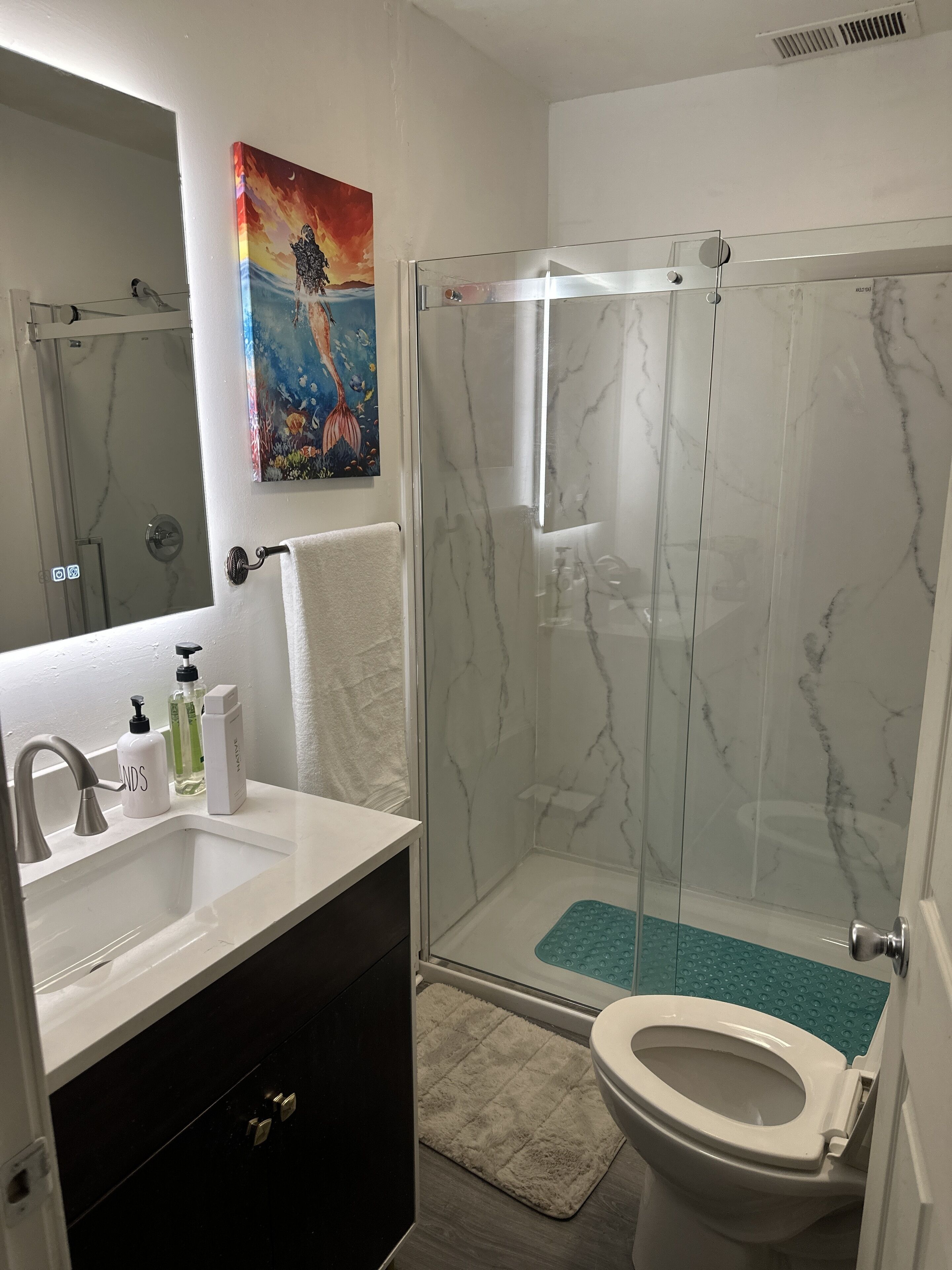 Shower, hair dryer, towels, soap