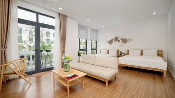 Enjoy a city view from the large window, relax on the comfortable sofa, and unwind in the clean-lined bed.