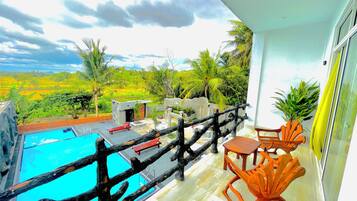Outdoor pool, open 8:00 AM to 10:00 PM, pool umbrellas