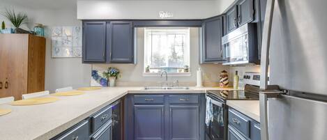 Fridge, microwave, stovetop, coffee/tea maker