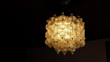 A chandelier with multiple spherical glass elements and a central fixture.