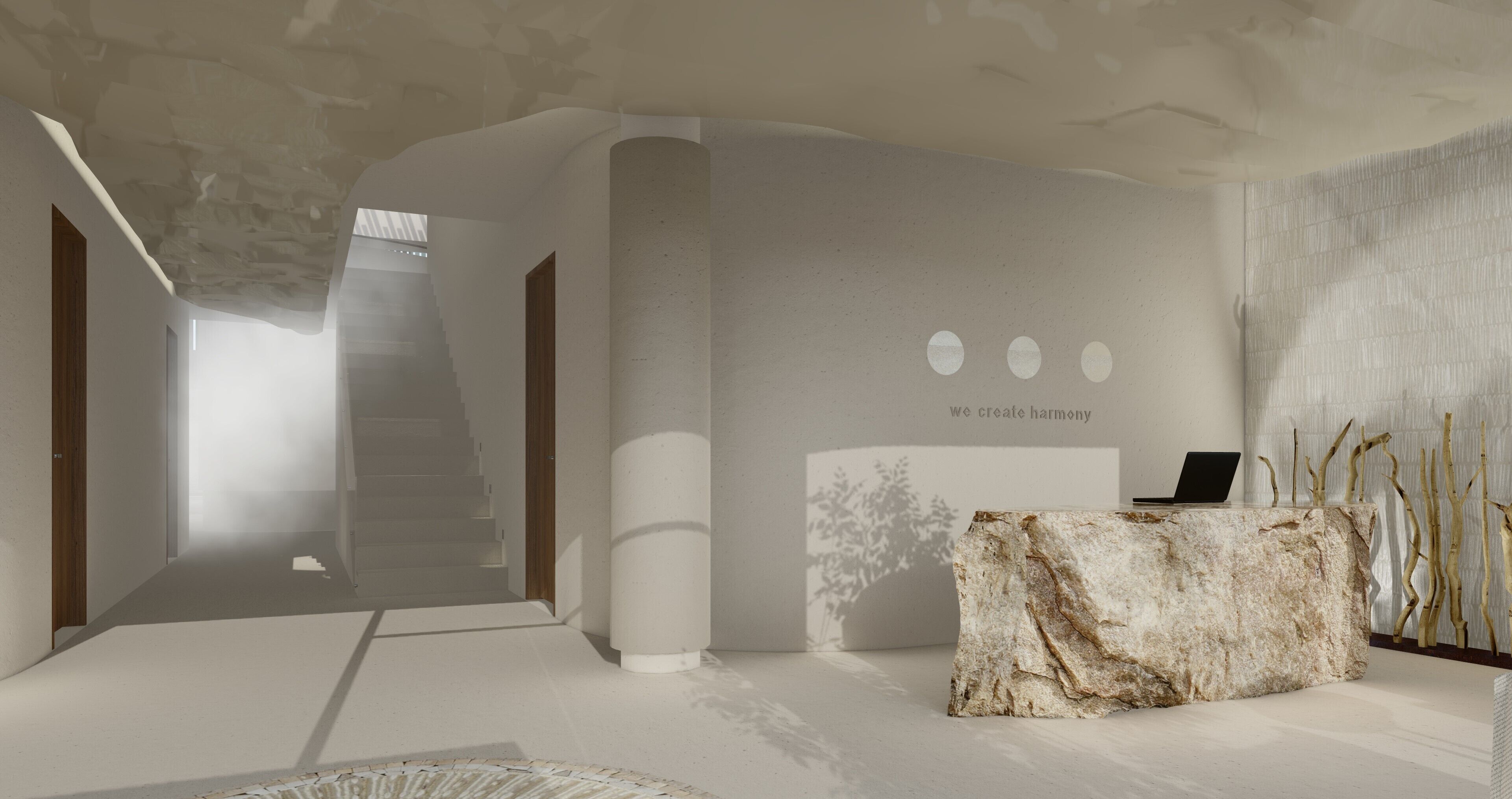A modern interior with a reception desk, a staircase, and a wall with a text message.