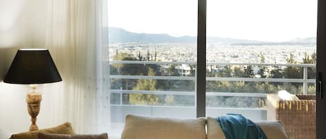 Luxury Apartment | Living area | Flat-screen TV