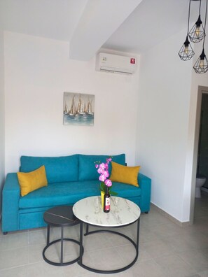 Comfort Apartment, Mountain View | Living area | 32-inch Smart TV with cable channels - Kavros Cozy Apartment with mountain view (Apokoronas)