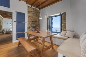 Villa, 2 Bedrooms | Living area | 48-inch flat-screen TV with cable channels, fireplace, books - Peftasteri Villa (Tinos)
