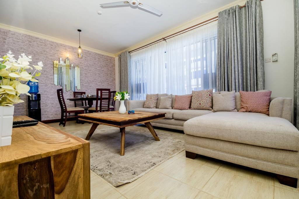 Apartamento executivo | Área de estar | Smart TV 24 polegadas com canais digitais