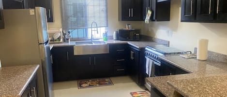 Full-size fridge, toaster, cookware/dishes/utensils